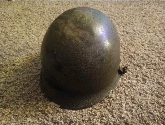 Authentic WWII U.S. Army M1 steel helmet shell, featuring honest battlefield wear and a hand - painted soldier name: “Keane” - Workshop & Study